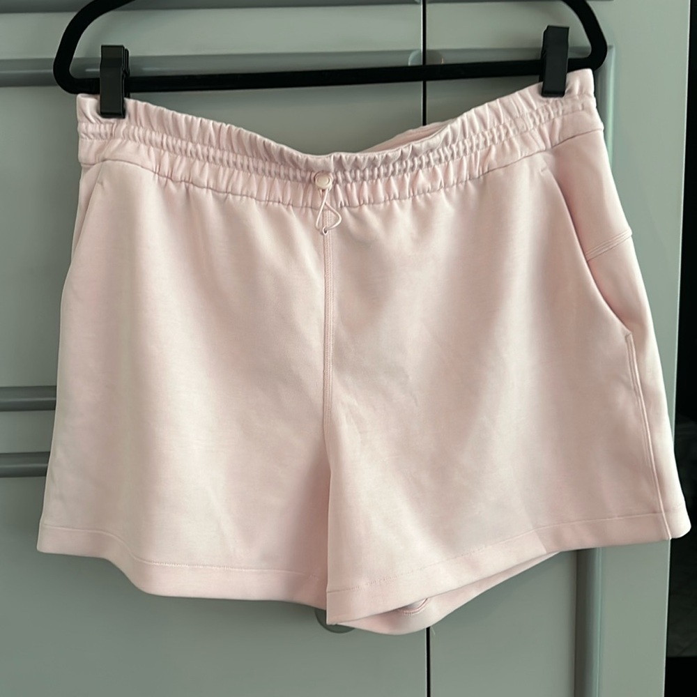 Pink woman’s lululemon shorts with pockets